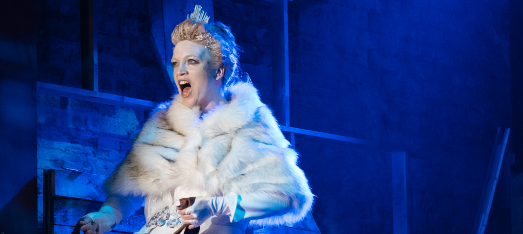 A picture of the Show Queen in a white fur cape